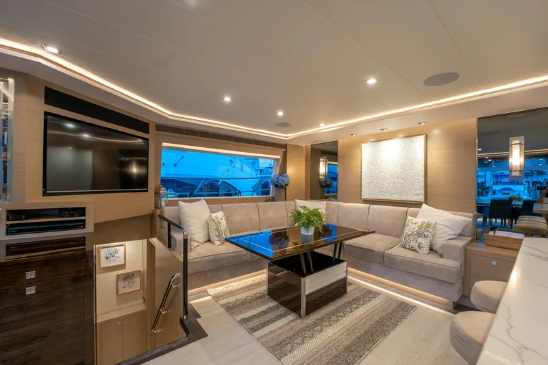 Fruition Yacht Photos Pics Luxurious interior of 2020 Horizon PC60 yacht with modern decor and ambient lighting.