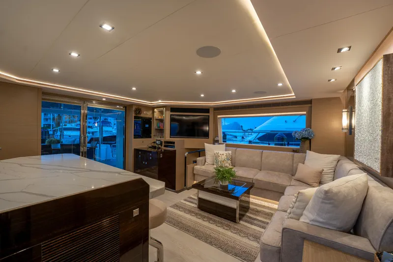 Fruition Yacht Photos Pics Luxurious interior of 2020 Horizon PC60 yacht with modern furnishings and ambient lighting.
