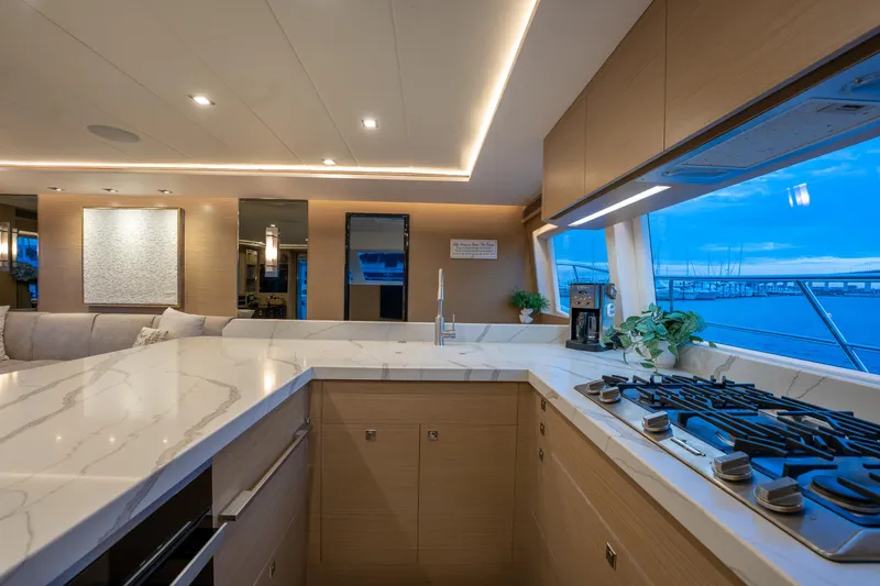 Fruition Yacht Photos Pics Luxurious kitchen interior on 2020 Horizon PC60 yacht with modern design and ocean view.