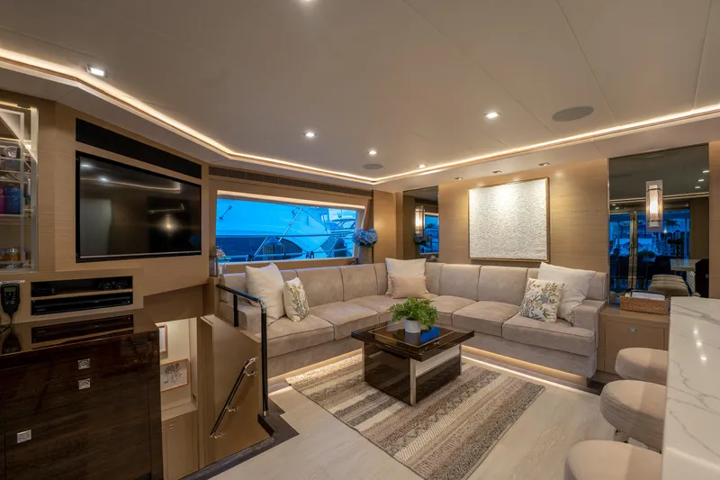 Fruition Yacht Photos Pics Luxurious interior of 2020 Horizon PC60 yacht with modern decor and ambient lighting.