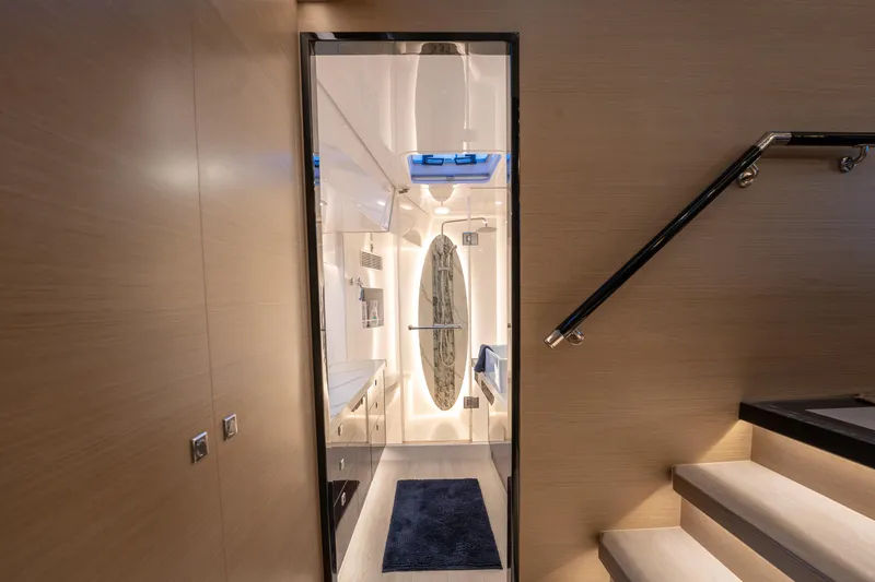 Fruition Yacht Photos Pics Luxurious interior of 2020 Horizon PC60 yacht with modern design and elegant staircase.