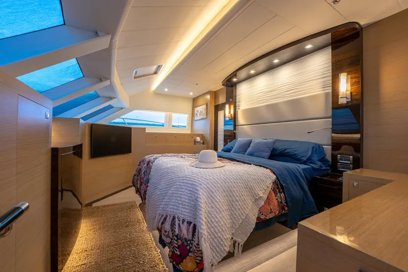 Fruition Yacht Photos Pics Luxurious bedroom interior on 2020 Horizon PC60 yacht with modern design and skylights.