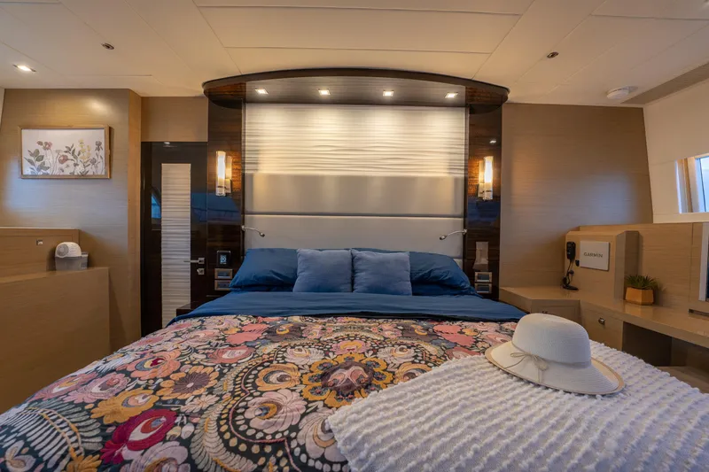 Fruition Yacht Photos Pics Luxurious bedroom interior of 2020 Horizon PC60 yacht with elegant decor and ambient lighting.