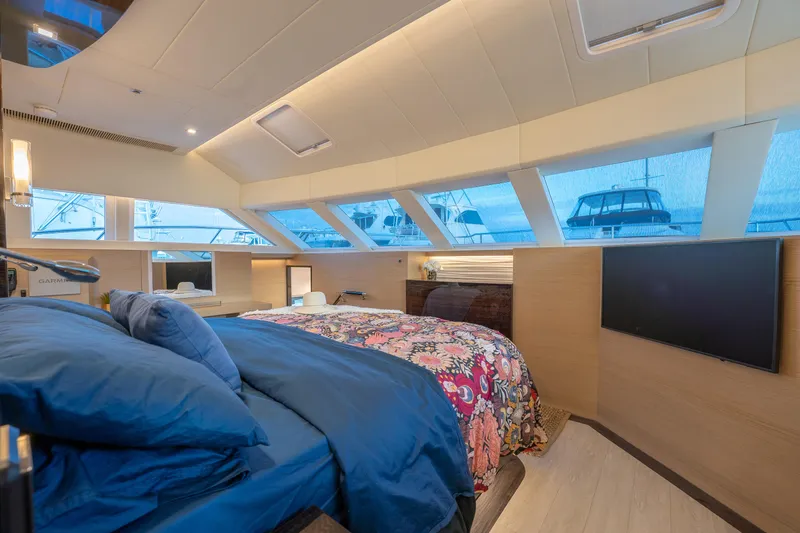 Fruition Yacht Photos Pics Luxurious Horizon PC60 yacht bedroom with panoramic windows and modern decor, 2020 model.