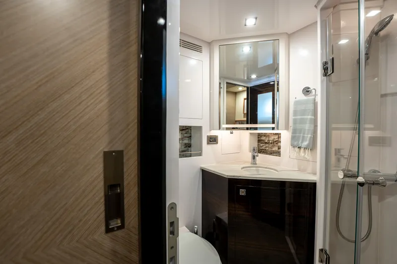 Fruition Yacht Photos Pics Luxurious bathroom in 2020 Horizon PC60 yacht with modern fixtures and elegant design.