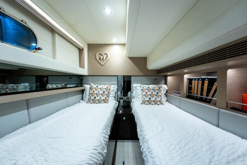 Fruition Yacht Photos Pics Luxurious twin cabin in 2020 Horizon PC60 yacht with modern decor and cozy bedding.