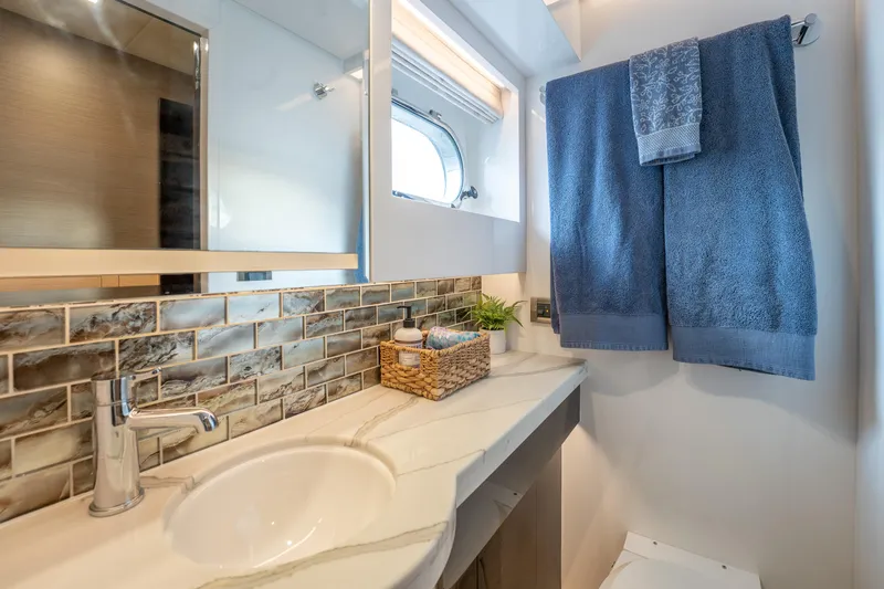 Fruition Yacht Photos Pics Luxurious bathroom in 2020 Horizon PC60 yacht with modern fixtures and elegant design.