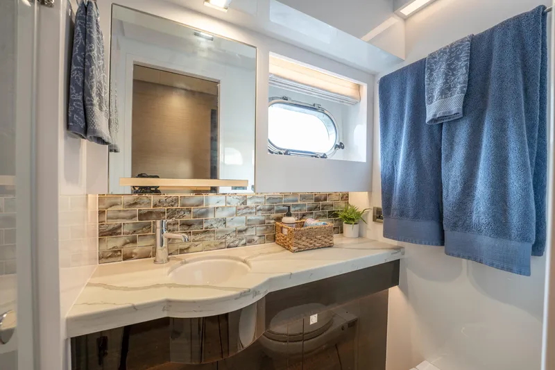 Fruition Yacht Photos Pics Luxurious bathroom in 2020 Horizon PC60 yacht with modern fixtures and elegant decor.