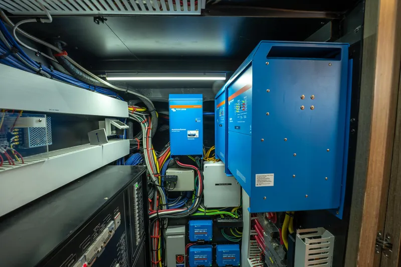 Fruition Yacht Photos Pics Electrical system setup in a Horizon PC60, 2020 model, featuring blue power units and wiring.