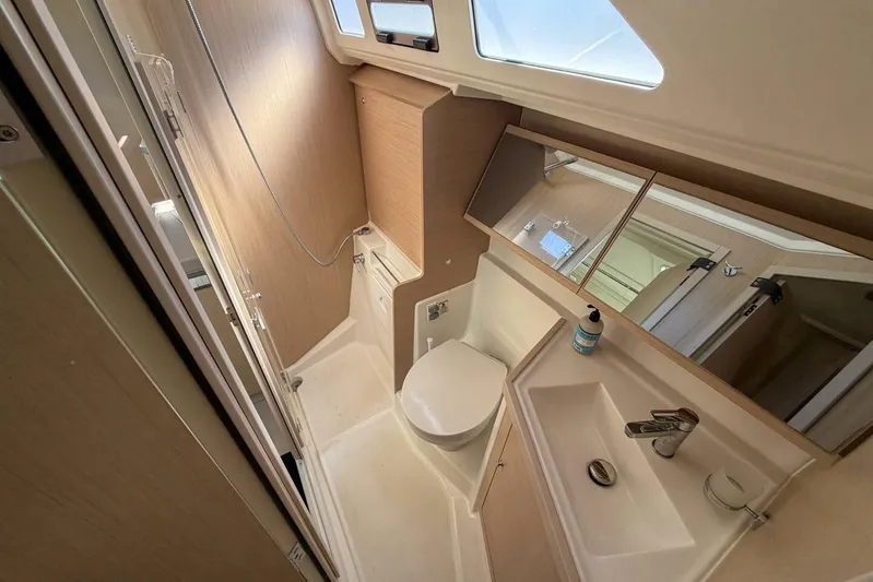 Happy Ours Yacht Photos Pics Modern bathroom in 2022 Beneteau Oceanis 40.1 yacht, featuring sleek design and fixtures.