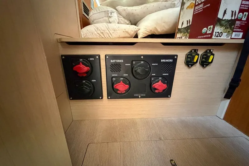 Happy Ours Yacht Photos Pics Electrical panel on 2022 Beneteau Oceanis 40.1 yacht, featuring battery and breaker controls.