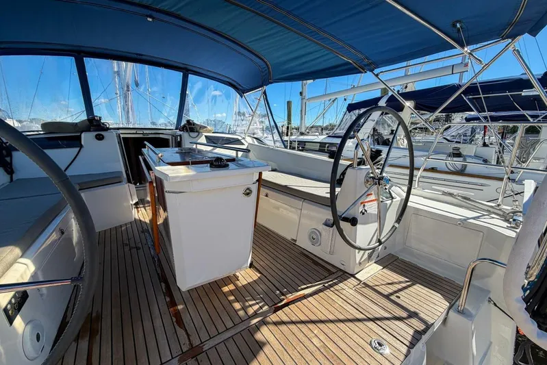 Happy Ours Yacht Photos Pics 2022 Beneteau Oceanis 40.1 yacht cockpit with dual steering wheels and teak flooring.