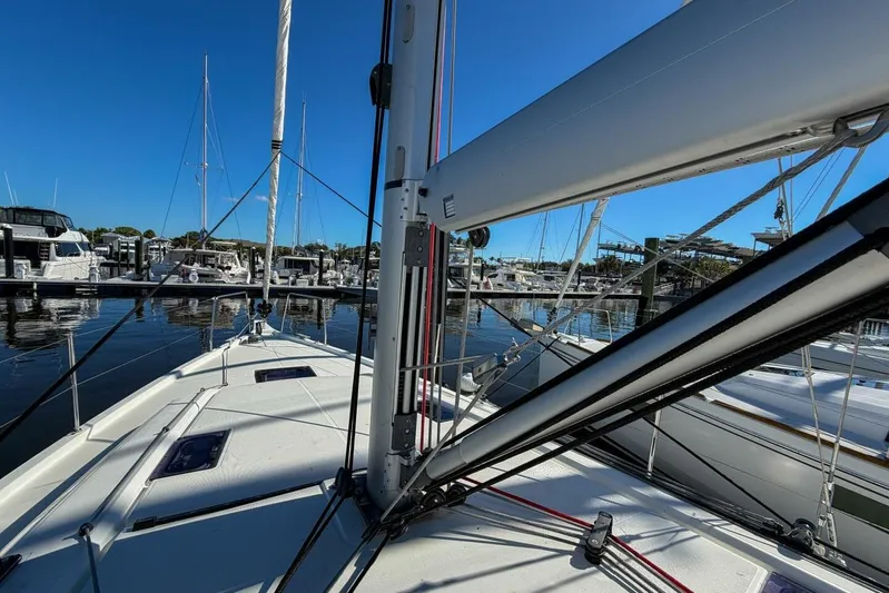 Happy Ours Yacht Photos Pics Beneteau Oceanis 40.1 sailboat docked at marina, 2022 model, clear blue sky.