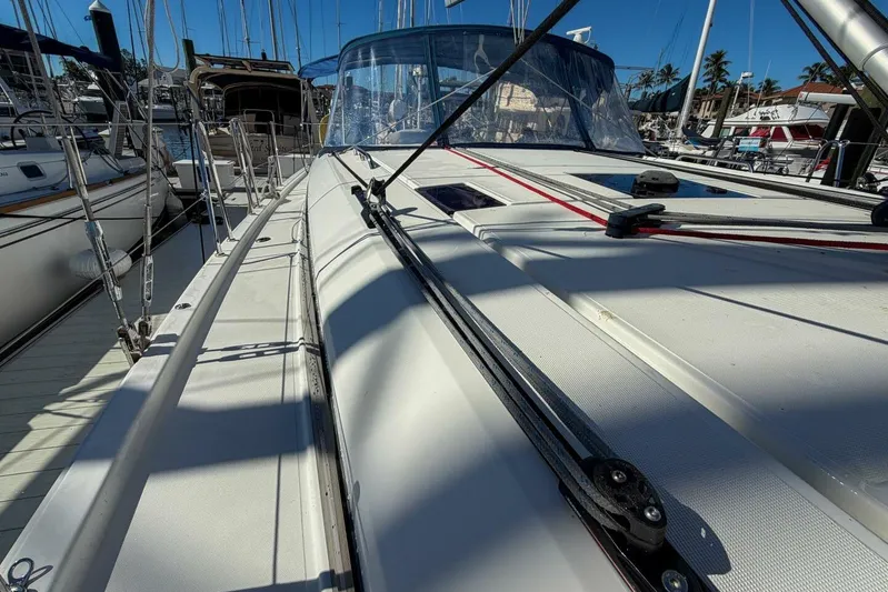 Happy Ours Yacht Photos Pics 2022 Beneteau Oceanis 40.1 sailboat deck view in marina, showcasing sleek design and rigging.