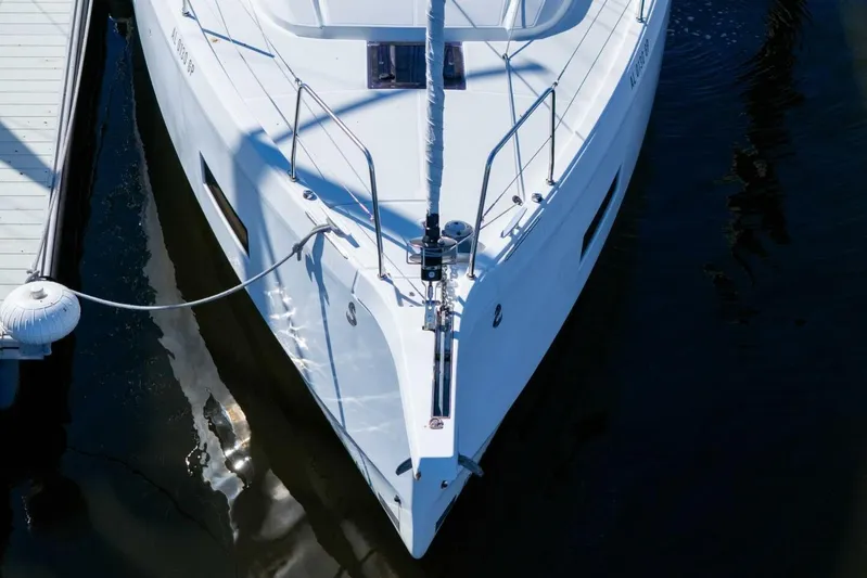 Happy Ours Yacht Photos Pics 2022 Beneteau Oceanis 40.1 yacht docked, aerial view of sleek white hull.