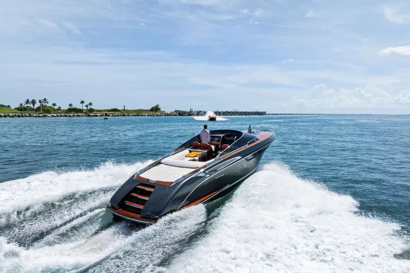 Grey Yacht Photos Pics 2023 Riva Rivamare luxury yacht cruising on open water.