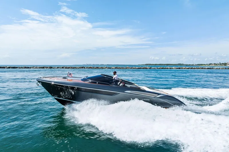Grey Yacht Photos Pics 2023 Riva Rivamare luxury yacht cruising on open water.