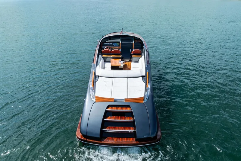 Grey Yacht Photos Pics 2023 Riva Rivamare luxury yacht cruising on open water, showcasing elegant design.