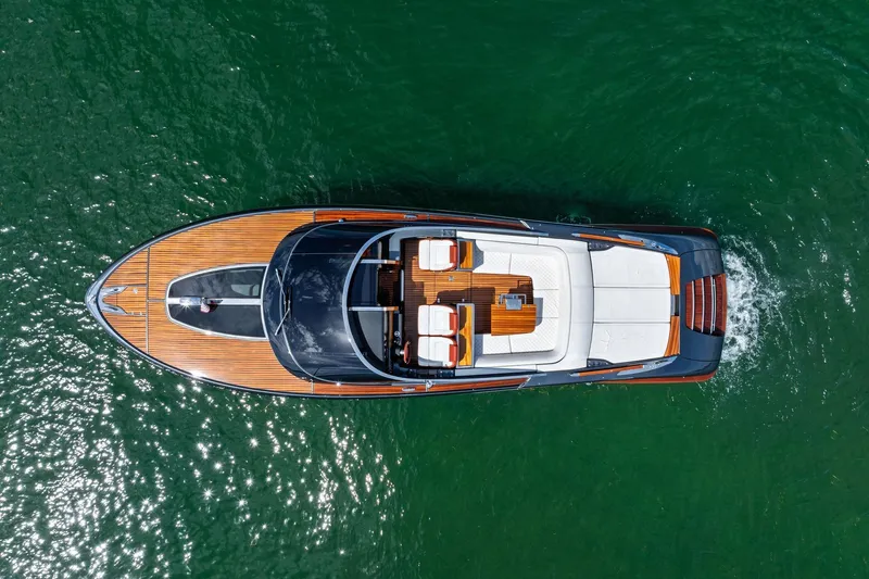 Grey Yacht Photos Pics Overhead view of 2023 Riva Rivamare luxury yacht on green water.