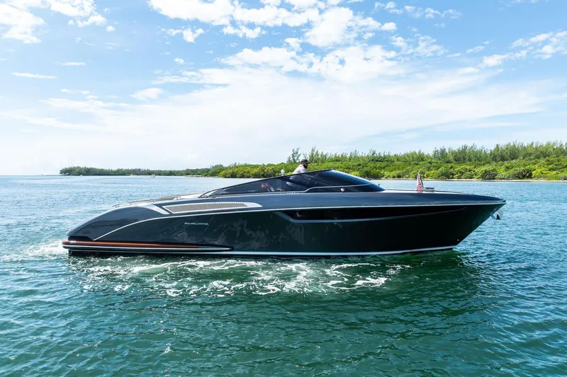 Grey Yacht Photos Pics 2023 Riva Rivamare luxury yacht cruising on a sunny day.