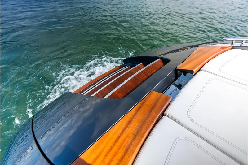 Grey Yacht Photos Pics 2023 Riva Rivamare luxury yacht with sleek wood and leather design on water.
