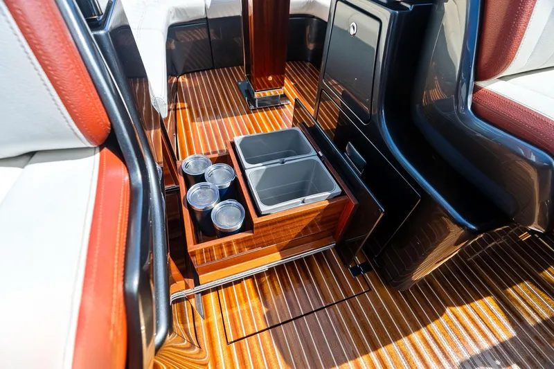 Grey Yacht Photos Pics Luxurious interior of 2023 Riva Rivamare yacht with elegant wood flooring and storage compartments.