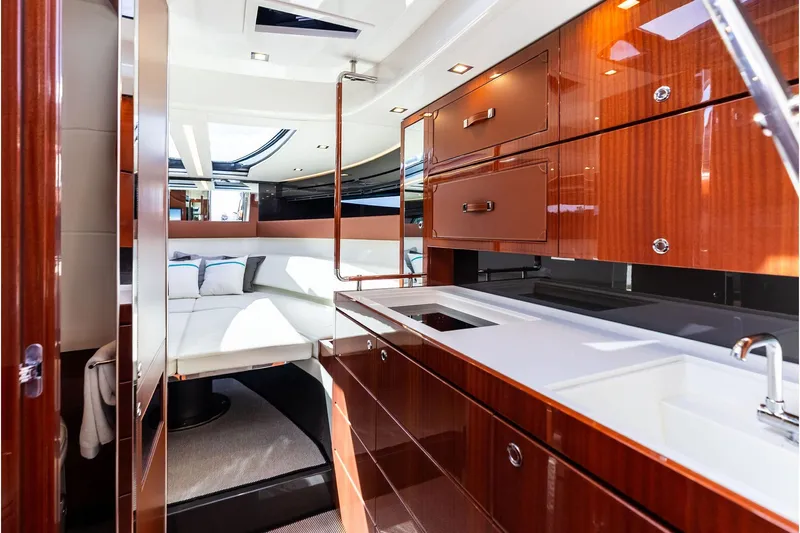 Grey Yacht Photos Pics Luxurious interior of 2023 Riva Rivamare yacht with sleek wood finishes and modern amenities.