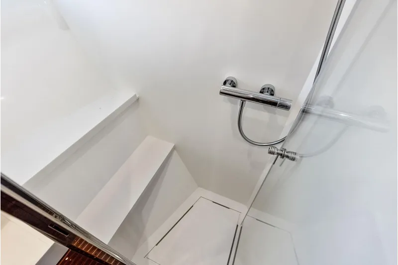 Grey Yacht Photos Pics Modern shower area in 2023 Riva Rivamare yacht, featuring sleek chrome fixtures.