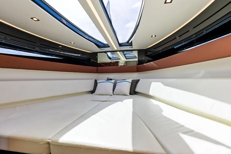 Grey Yacht Photos Pics Luxurious interior of 2023 Riva Rivamare yacht with plush seating and skylight.