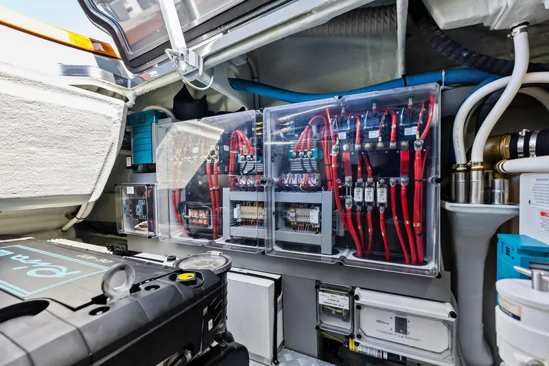 Grey Yacht Photos Pics Engine room of 2023 Riva Rivamare yacht with electrical components and wiring.