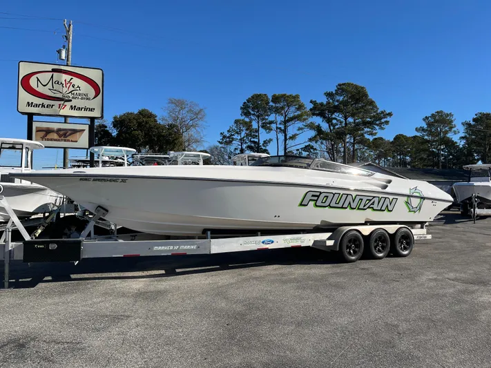  Yacht Photos Pics 2007 Fountain 35 Lightning boat on trailer at marine dealer.