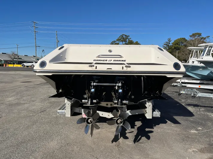  Yacht Photos Pics Rear view of a 2007 Fountain 35 Lightning boat in a parking lot.