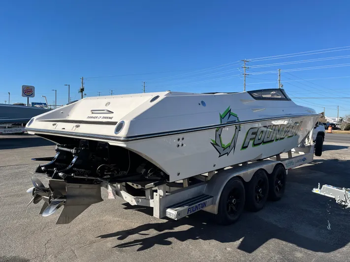  Yacht Photos Pics 2007 Fountain 35 Lightning boat on trailer, side view.