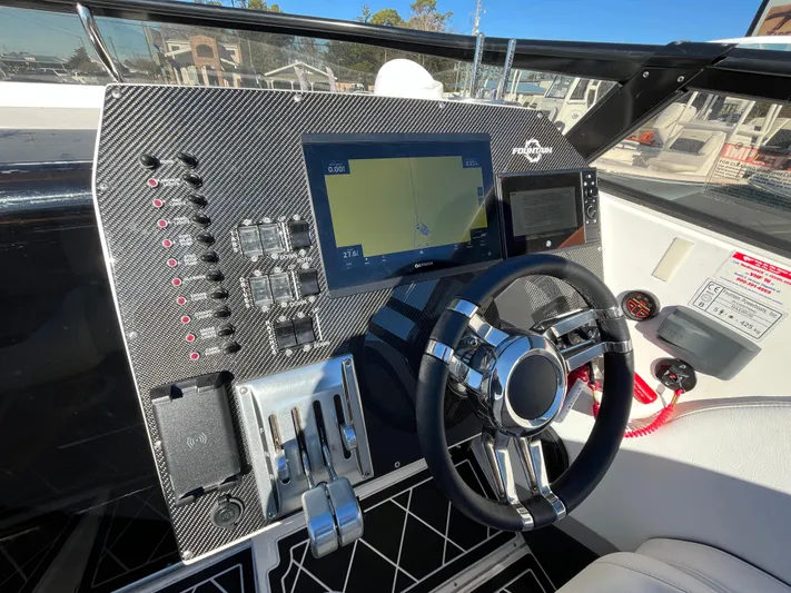  Yacht Photos Pics Dashboard of a 2007 Fountain 35 Lightning boat with navigation system.