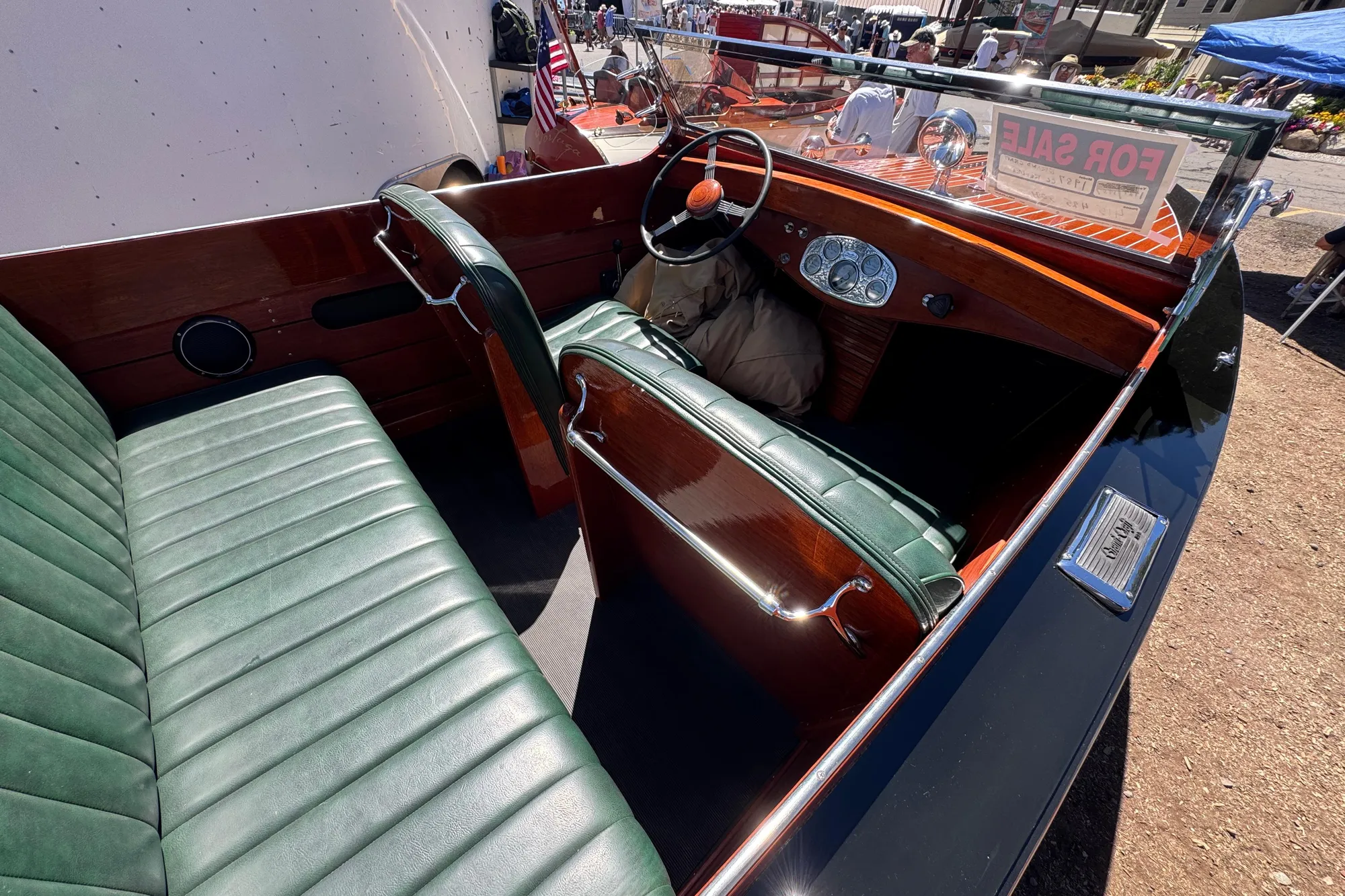 1987 Grand Craft Triple Cockpit Runabout with green leather seats and wooden dashboard, for sale.