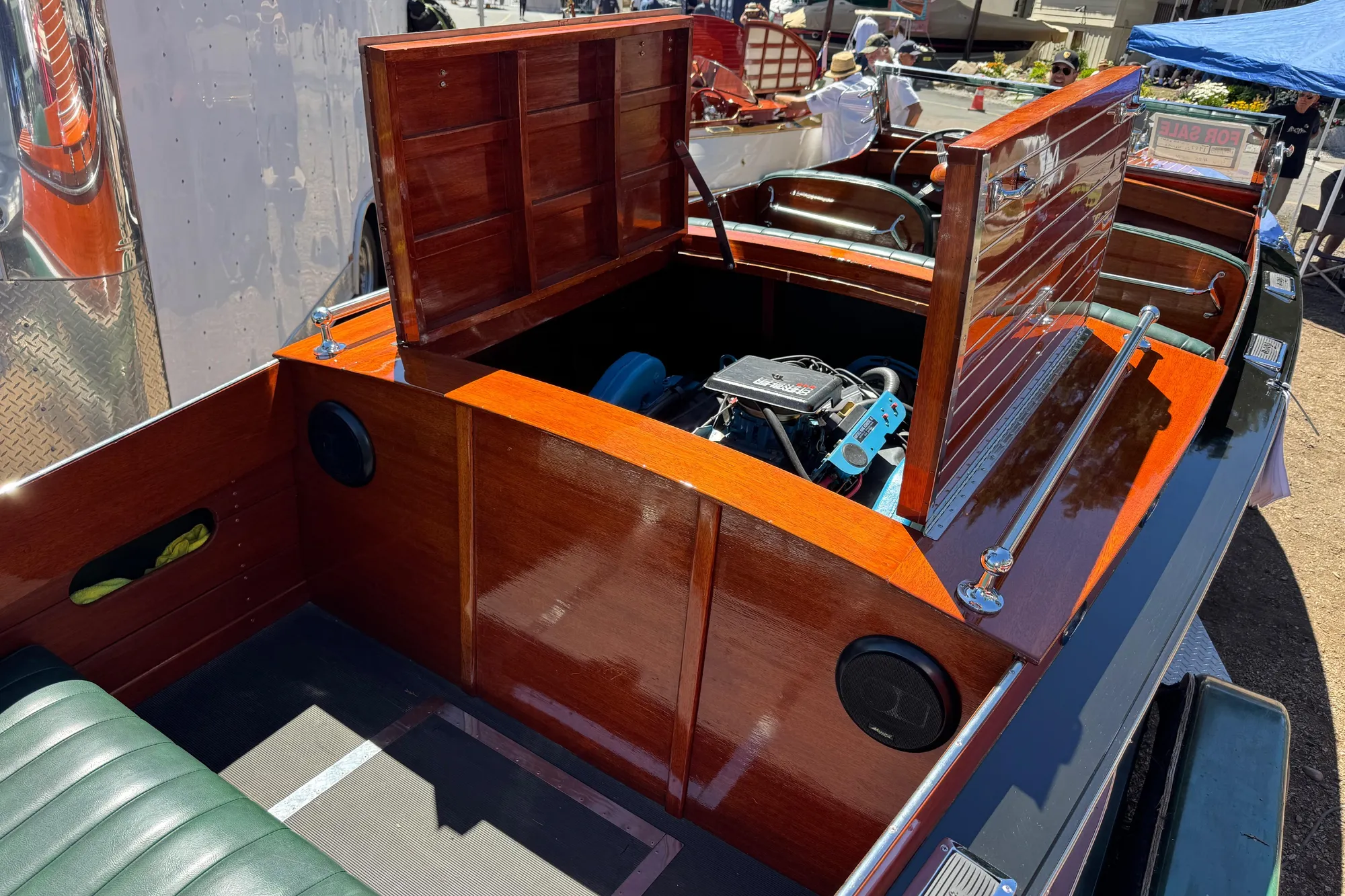 1987 Grand Craft Triple Cockpit Runabout with open engine compartment, showcasing polished wood finish.