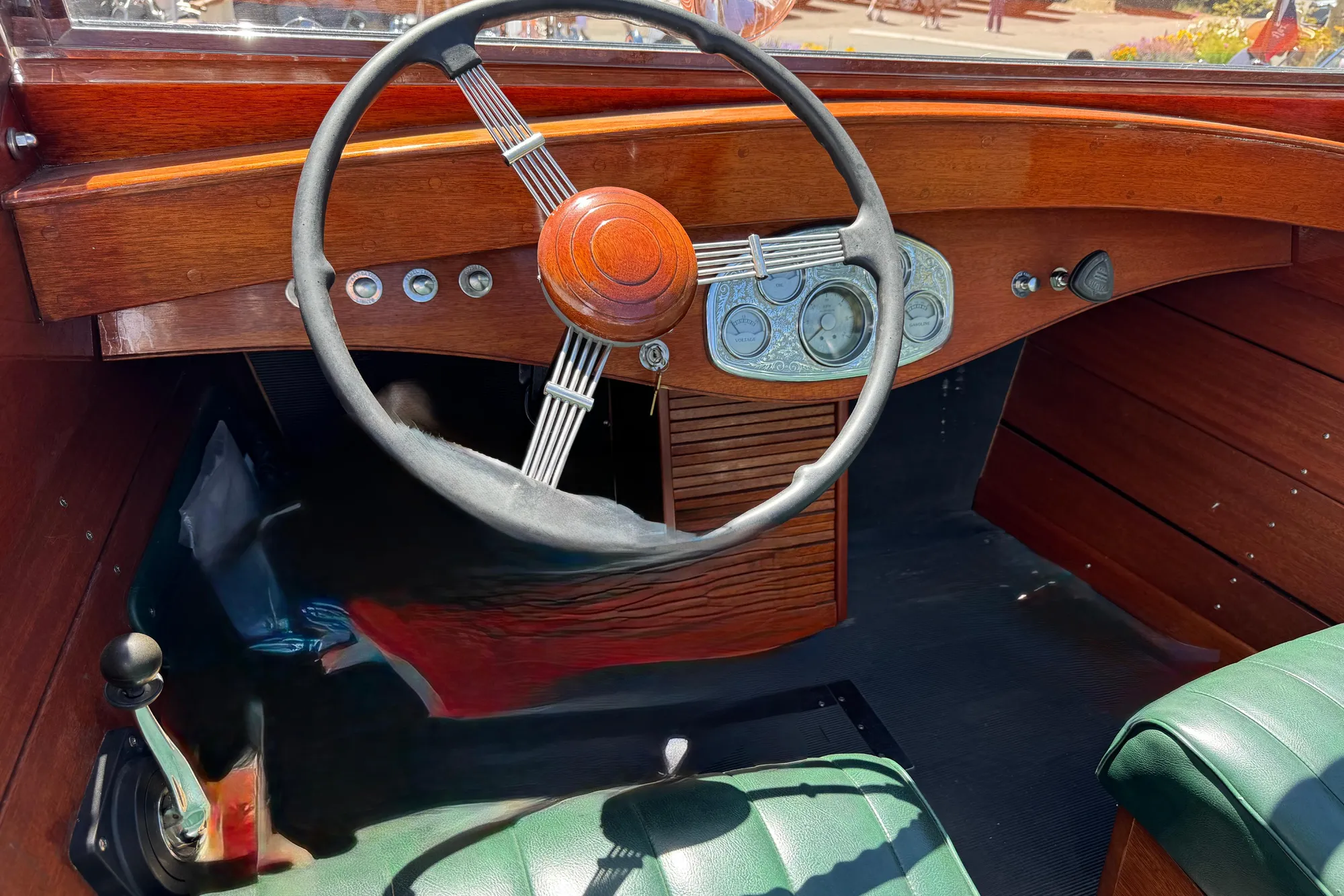 1987 Grand Craft Triple Cockpit Runabout interior with wooden dashboard and vintage steering wheel.