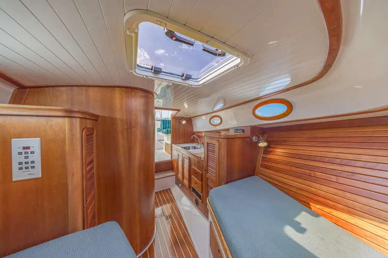 Genie Yacht Photos Pics Interior of a 1999 Hinckley Picnic Boat with wooden finishes and skylight.