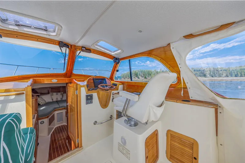 Genie Yacht Photos Pics 1999 Hinckley Picnic Boat interior with wooden accents and scenic water view.