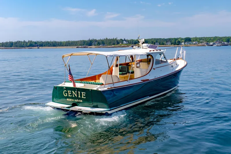 Genie Yacht Photos Pics 1999 Hinckley Picnic Boat cruising on calm waters, displaying "Genie" and "North Haven."