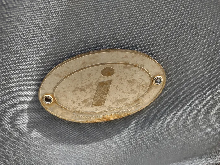 Wu Wei Yacht Photos Pics Brass plaque on Pacific Seacraft 37 sailboat, 1997 model, with engraved "i" symbol.