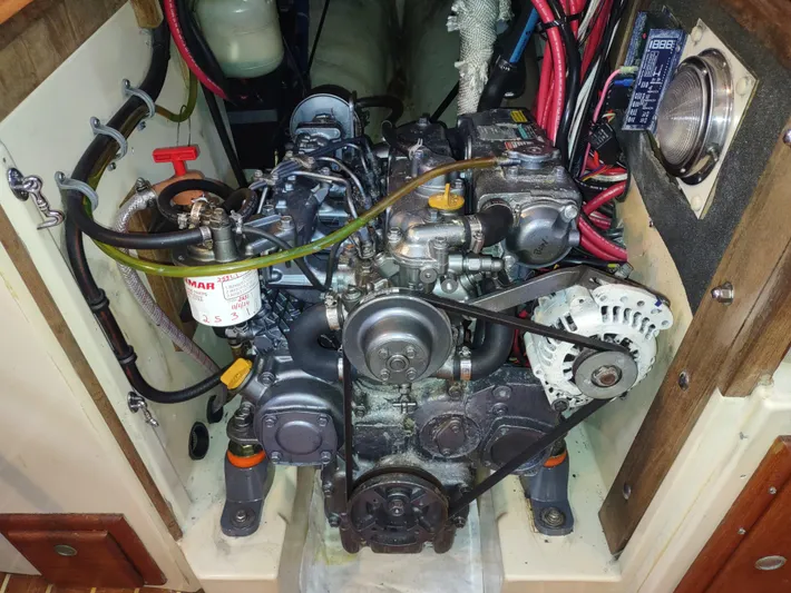 Wu Wei Yacht Photos Pics Engine compartment of a 1997 Pacific Seacraft 37 sailboat, featuring a Yanmar diesel engine.