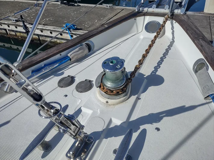 Wu Wei Yacht Photos Pics Deck of 1997 Pacific Seacraft 37 sailboat with anchor chain and winch.