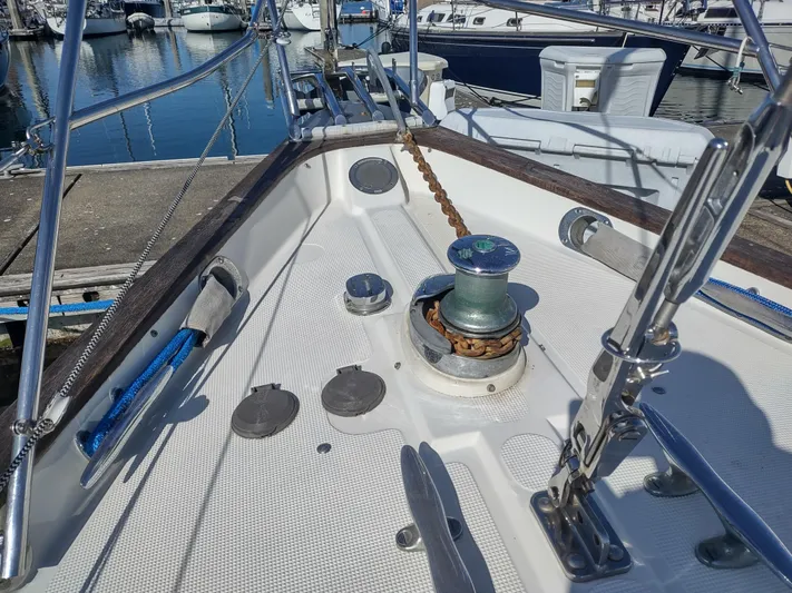 Wu Wei Yacht Photos Pics Bow of a 1997 Pacific Seacraft 37 sailboat with anchor chain and winch.