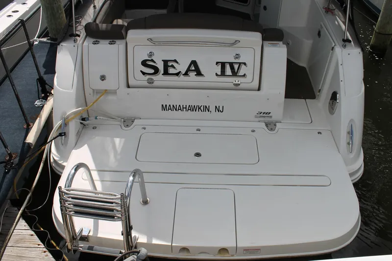  Yacht Photos Pics 2015 Sea Ray Sundancer 310 boat docked in Manahawkin, NJ, featuring swim platform.