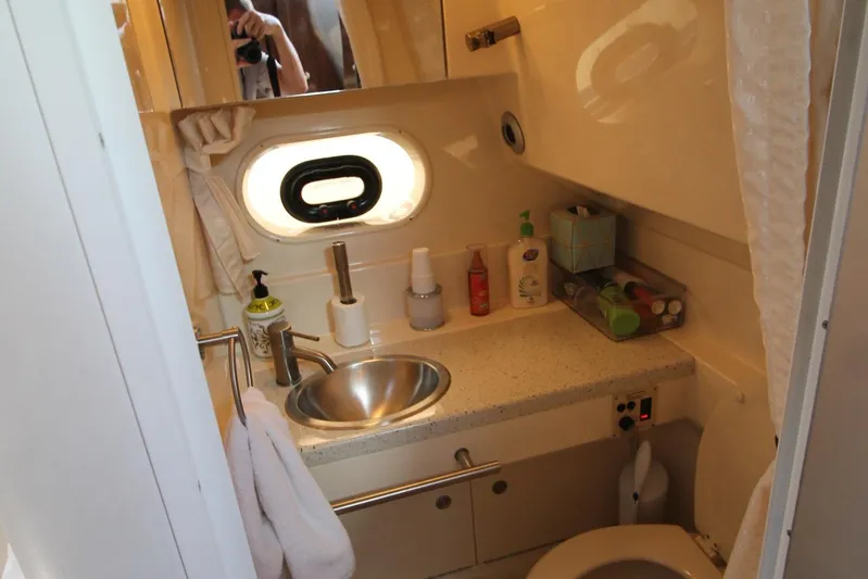  Yacht Photos Pics Compact bathroom in 2015 Sea Ray Sundancer 310 yacht with sink and toiletries.