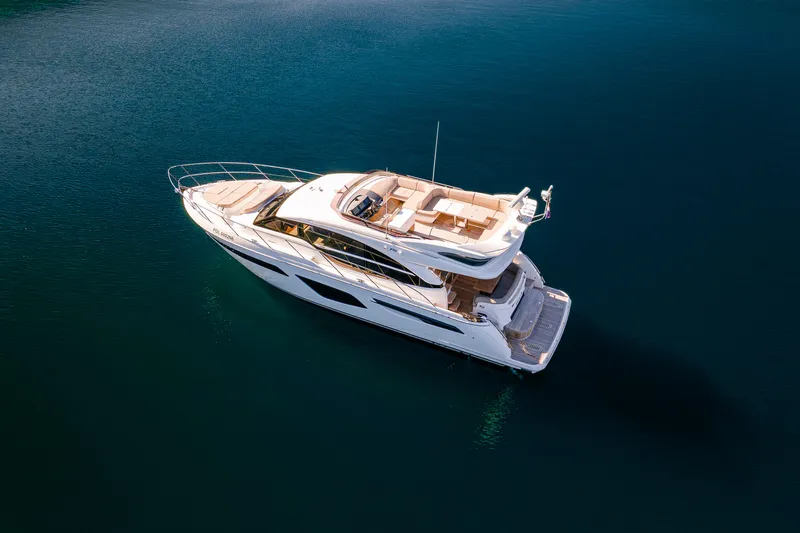 Whiskey Yacht Photos Pics Luxury Princess F55 yacht cruising on calm blue waters, 2021 model.