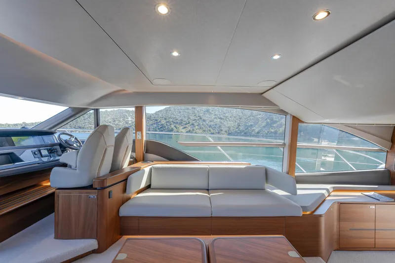 Whiskey Yacht Photos Pics Luxurious interior of 2021 Princess F55 yacht with modern seating and scenic views.