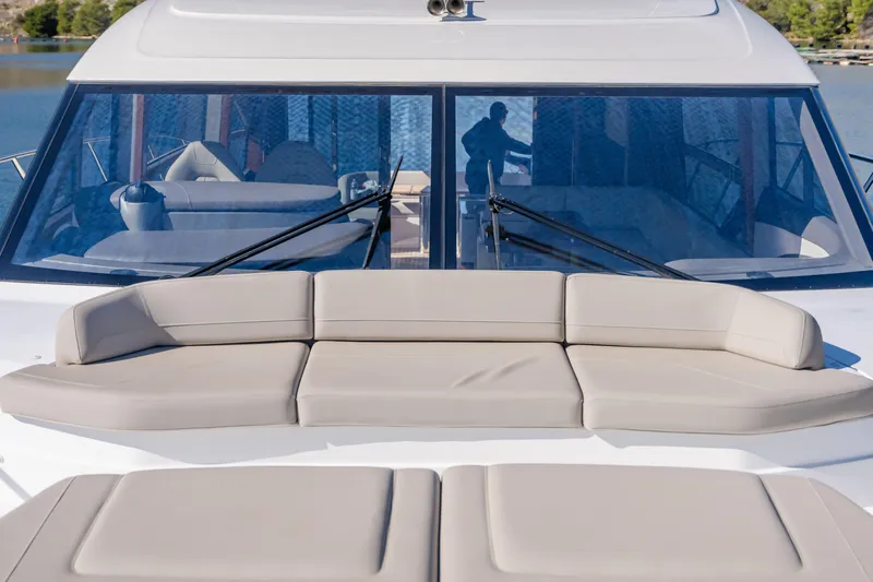 Whiskey Yacht Photos Pics 2021 Princess F55 yacht with beige seating and large windows.