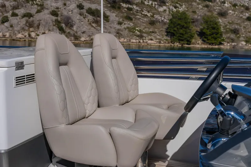 Whiskey Yacht Photos Pics Luxurious seating on 2021 Princess F55 yacht with scenic background.